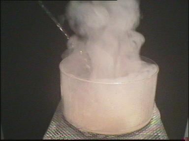 The reaction is strongly exothermic. Water vapor is formed