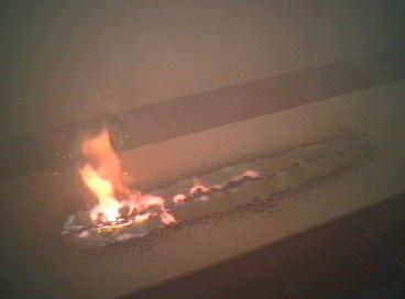 Reaction ends; smoke and burning residues