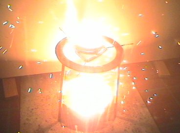 Thermit reaction begins; white hot liquid iron seeps out